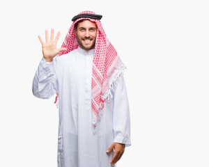 Young handsome man wearing keffiyeh over isolated background showing and pointing up with fingers number five while smiling confident and happy.