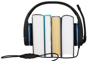 wireless headphones with a microphone on books isolated on a white background