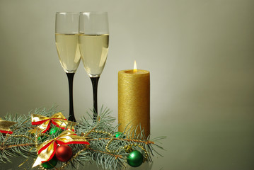 Two glasses of champagne and carnival masks