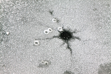 cracked ice on river in winter
