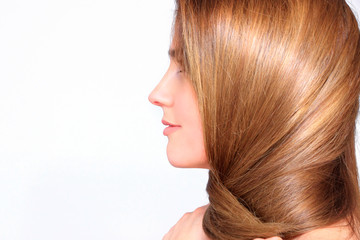 Profile of a beautiful woman with long blond hair