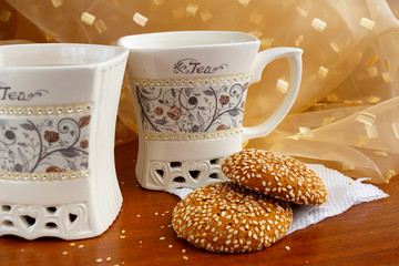 A cup of tea with delicious sweets on the table