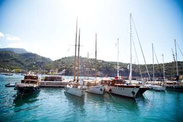 yachts on the background of bright blue sea and mountains