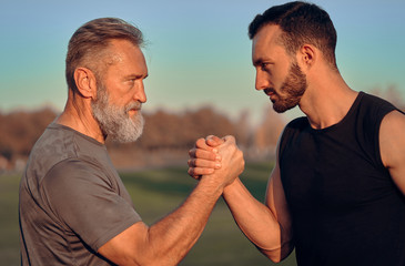 The father and son holding hands