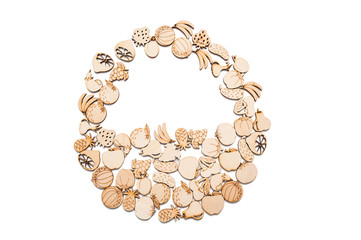 Handmade wooden fruits and vegetables in the shape of a basket