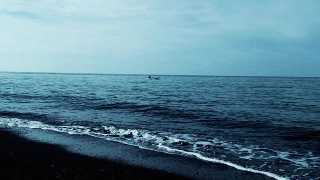 Beach Scenery Cinematic Look Fisherman Rowing Boat At The Sea Of Umeanyar Beach, North Bali, Indonesia