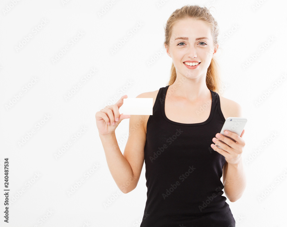 Wall mural young pretty lady holding a phone and business card isolated on white