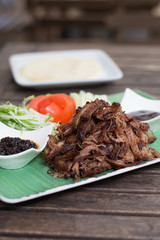 Succulent crispy duck, plum sauce, chilli oil, spring onion , cucumber, pancake wraps.