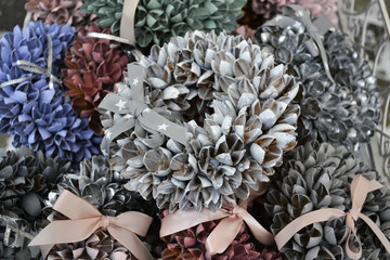 Christmas wreath of silver, red and blue cones. Closeup.