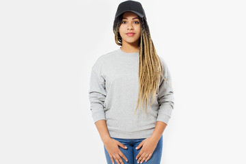 African american girl in template blank sweatshirt and cap isolated on white background. Front...