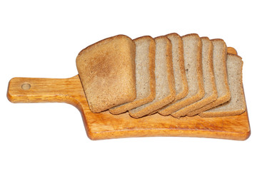 Slices of black bread on a wooden kitchen board isolated on white background