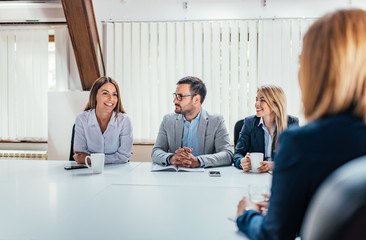 Business people talking at meeting room.