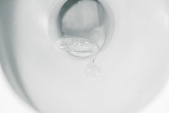 Condom on pan in toilet. Sex concept Stock Photo | Adobe Stock