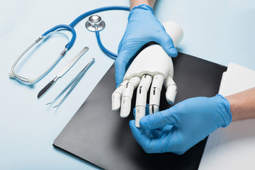 Mechanical prosthetic arm for disabled. Consultation with doctor.