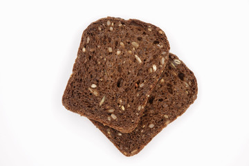 black bread with seeds on white background