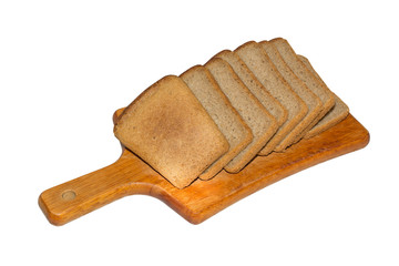 Slices of black bread on a wooden kitchen board isolated on white background