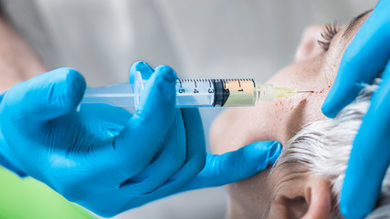 PRP Face Injecting Treatment.  Cosmetic Anti-Aging Platelet Rich Plasma Treatment