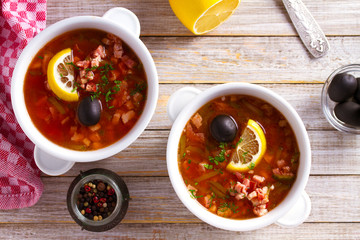 Russian dish  solyanka - thick, spicy and sour saltwort soup. overhead, horizontal