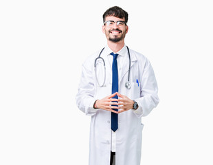 Young doctor man wearing hospital coat over isolated background Hands together and fingers crossed smiling relaxed and cheerful. Success and optimistic