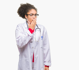 Young afro american doctor woman over isolated background bored yawning tired covering mouth with...
