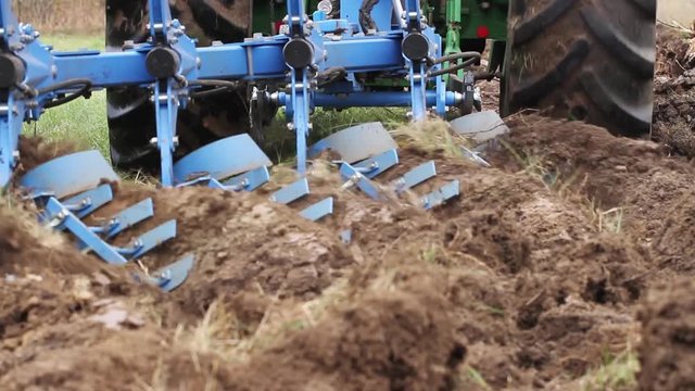 LATVIA, TUKUMS - 20 OKTOBER: Conventional deep plowing with metal disks and blades on 20 Oktober 2018, Tukums district, Latvia.