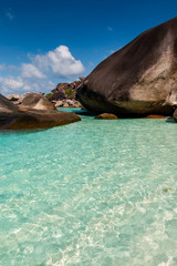 Crystal clear shallow water and granite rocks on a beautiful tropical sandy beach (Similan Islands, Thailand)
