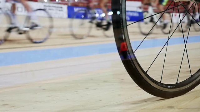 Men ride a bicycle, cycling. Cycling track Pursuit competition sequence.