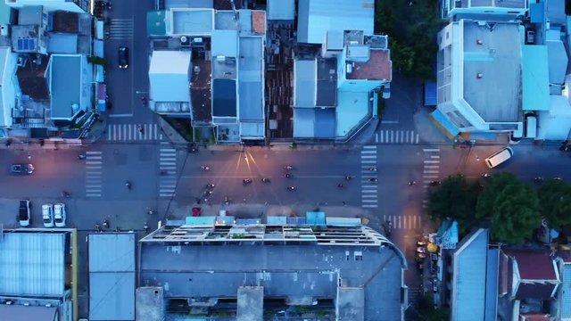evening flight over a busy street