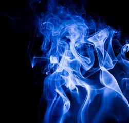 Fototapeta premium Blue smoke on black background