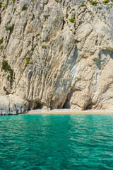 Greece, Zakynthos, White sand beach and turquiose water at impressive white rock wall