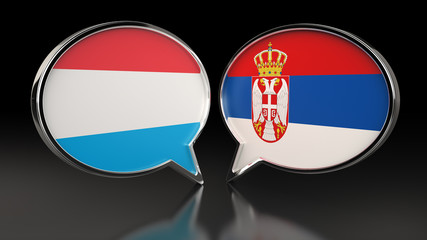 Luxembourg and Serbia flags with Speech Bubbles. 3D illustration