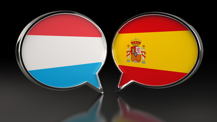 Luxembourg and Spain flags with Speech Bubbles. 3D illustration