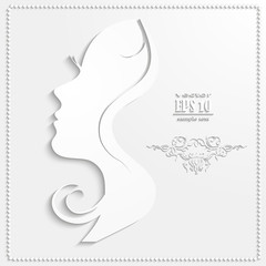 Profile of a beautiful woman cut out of paper