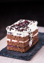 Chocolate sponge cake with blueberries and jam.
