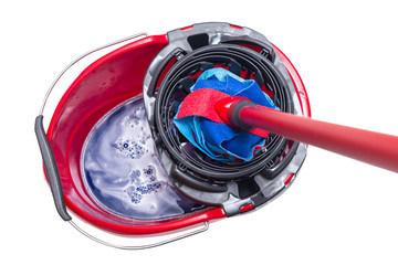 Red plastic bucket and floor mop