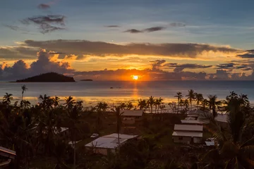 Fotobehang Early morning and sunrise over Pacific Ocean in Mata-Utu village, the capital of Wallis and Futuna territory (Wallis-et-Futuna), French overseas island collectivity. Downtown is overgrown with palms © Dmitry