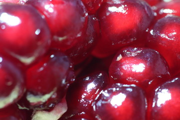 Pomegranate Slice Fruit. Close up Granate Seeds in slice. Macro photo. vitamine and Healthy concept.