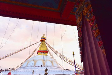View of Boudhanath Stupa During Sunset in the Evening from a Window in Kathmandu