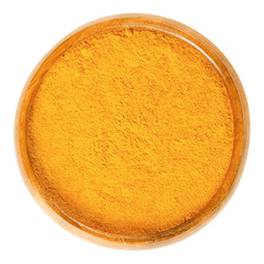 Turmeric powder in wooden bowl. Deep orange spice, used as coloring and flavoring agent for curries. Processed and ground rhizomes of Curcuma longa. Macro food photo closeup from above over white.