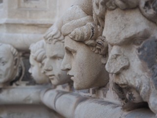 Carved stone faces