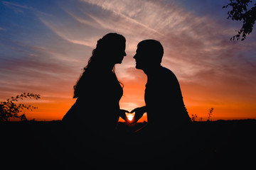  silhouette of lovers at sunset