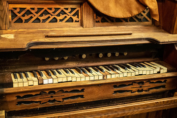 Old vintage broken piano with missing keys