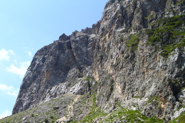 fantastic mountain slope with light blue sky, natural landscape photo