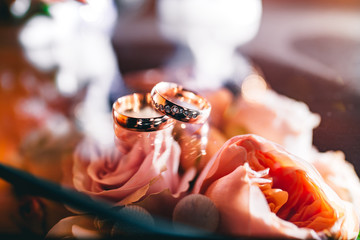 wedding rings on the glass table
