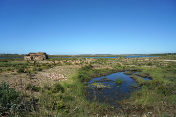 Salt lakes in Portugal in the Algarve on the border with Spain and its product in close up 