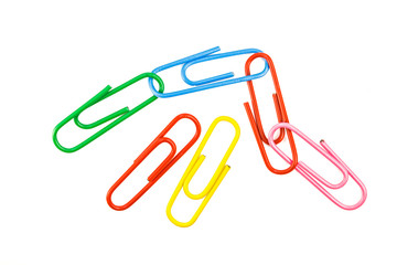 multicolored paper clip on white background, macro.  Colorful paper clip isolated on white background. Color clips for a paper