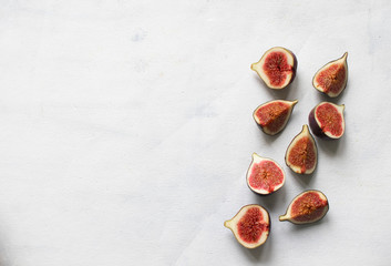 Fresh fig. Fruit with half and quarter on light background. Collection.