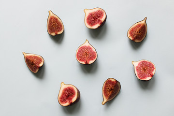 Fresh fig. Fruit with half and quarter on light background. Collection.