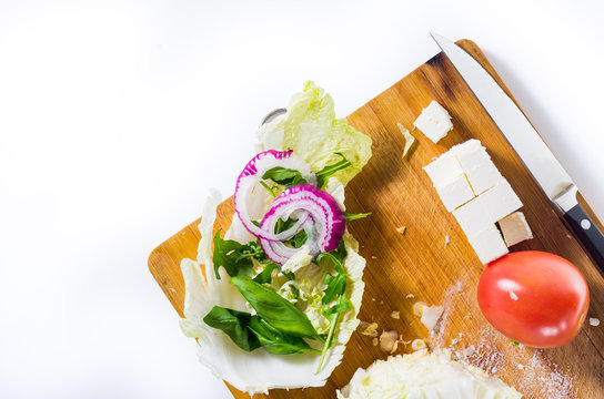 Vegetable Salad. Products and knife. Top view.