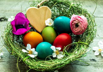 Frohe Ostern, Osternest mit bunten Ostereiern und Herz - Happy Easter,  Easter nest with colorful Easter eggs and heart